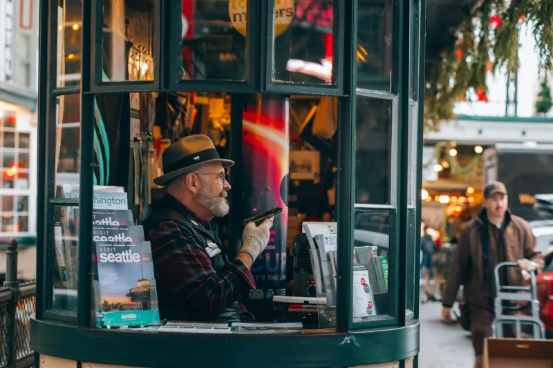 The Welcome Desk at Civilization's Edge: Why Every Culture Built the Same Booth for Lost Strangers